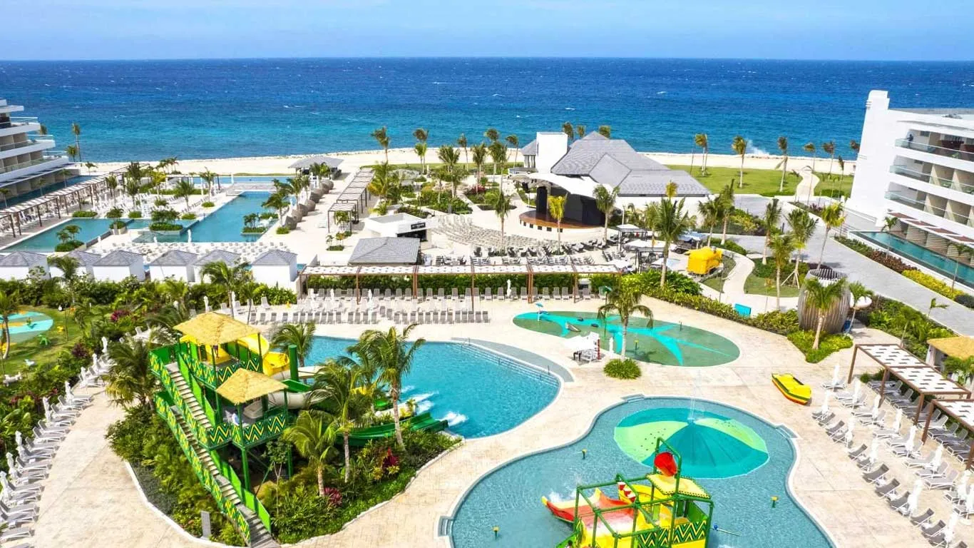 The pools at Princess Grand Jamaica, with the sea behind them