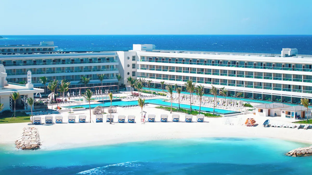 The beach in front of the resort, loungers along the sand